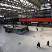 Police Office and National Rail Staff are seen at an empty Waterloo Station in London (Photo: Alex Davidson/Getty Images)