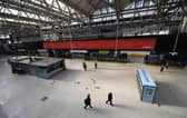 Police Office and National Rail Staff are seen at an empty Waterloo Station in London (Photo: Alex Davidson/Getty Images)