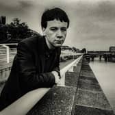 Simple Minds lead singer Jim Kerr standing at the River Clyde in Glasgow.  