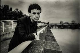 Simple Minds lead singer Jim Kerr standing at the River Clyde in Glasgow.  