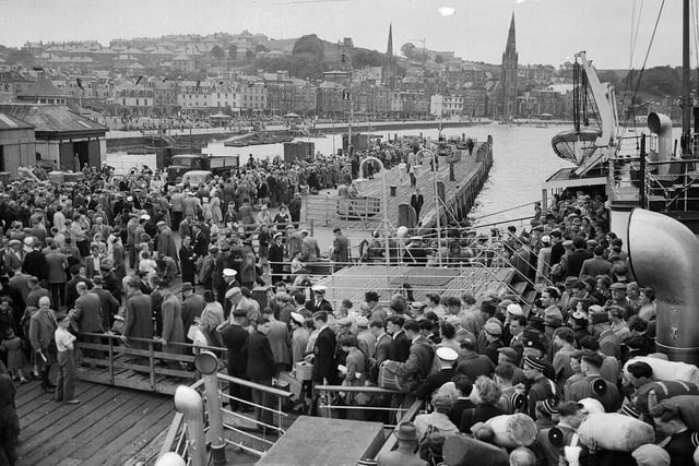 Crowds of holidaymakers coming ashore at Rothesay pier on July 17 1956 for the Glasgow Fair holiday.