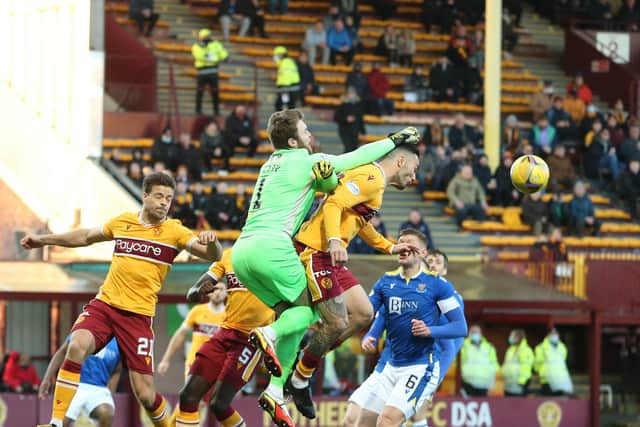 Tony Watt challenges Zander Clark with Sondre Solholm looking on