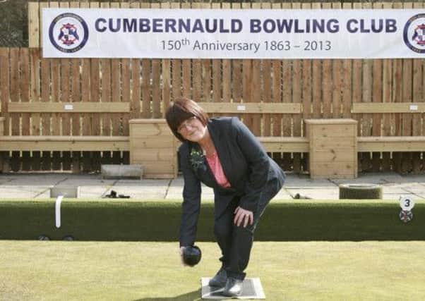 GETTING THE SEASON UNDER WAY: Margaret McMillan thorws the first bowl to open the green at Cumbernauld Bowling Club.