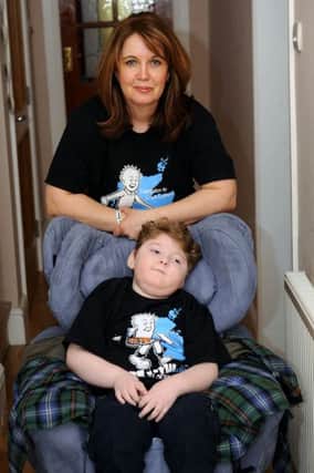 Date: 17/04/13, KILSYTH, picture of Donna Quinn and son logan, along with a picture of the ladies doing the charity walk.