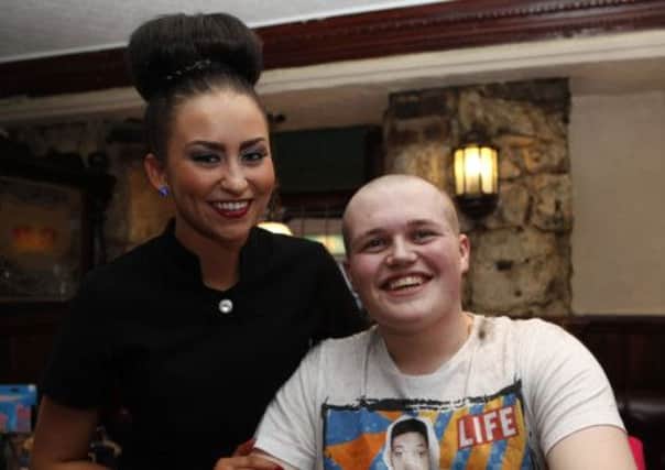 Crown Inn, chest waxing and head shaving for Scottish SPCA. 
 Sinead McQuade  with Andrew Blackburn getting his hair shaved off