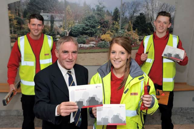 Picture  Councillor Sam Love with Mears apprentices Jordan Strong (1 st year joiner), Gillian Neil (3rd