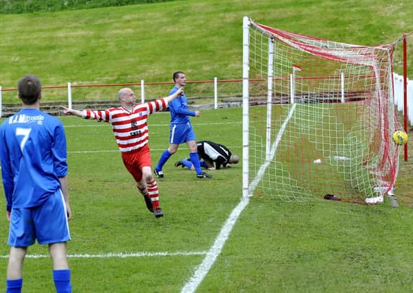 In the net...Lesmahagow Juniors 4-1 win against Dunipace was cemented with the last goal, being celebrated here at Craighead Park, Lesmahagow (Pic Lindsay Addison)