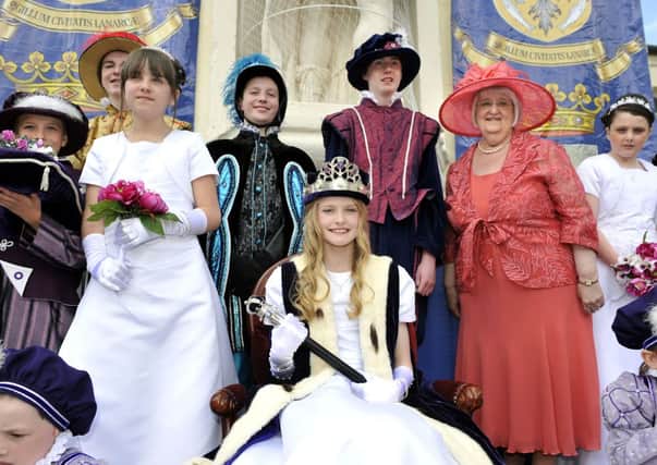 Queen crowned...Queen Erin Snow with Crowning Lady Mary Thirwell MBE and members of the court (Pic Lindsay Addison)
