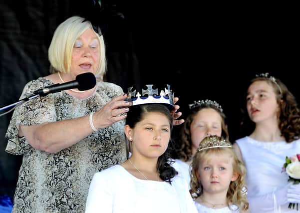 Crowning moment...2013 Carluke Gala Queen Chantelle Aitken is crowned by Christine Hare (Pic Lindsay Addison)