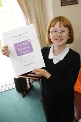 Picture, Gary Hutchison: CONDORRAT, picture of Morgan Coutts (10) who gave her hair to charity for kids with cancer.