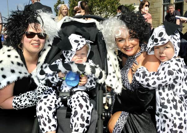 Not so cruel...Cruella and friends from 101 Dalmatians, aka Riverside Nursery, enjoy Carluke Gala Day (Pic Lindsay Addison)