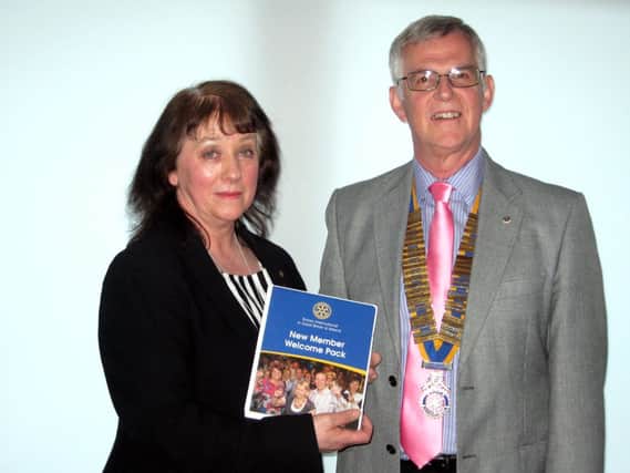 Rotary Club of Cumbernauld continues to go from strength to strength with the induction of its newest recruit Carrickstone lady Elizabeth Robertson who is employed in TESCO Craigmarloch as a Team Leader. Elizabeth is seen here being welcomed into the Club by President Brian Wilson.