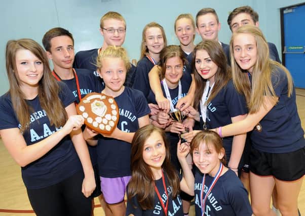 Cumbernauld Amateur Athletic Club - the young winners of recent meets proudly display their prizes.