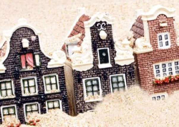 Houses and euro money in the sand