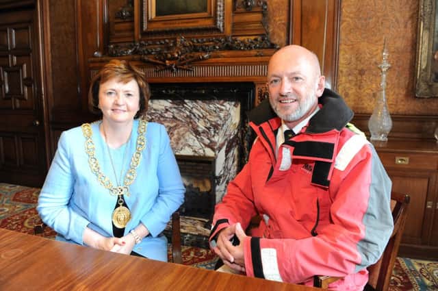 Photograph Jamie Forbes 9.8.13  GLASGOW, City Cambers - Lord Provost's Dining Room - Lord Provost Sadie Docherty congratulates St Roch's teacher Gerry Hughes (who is deaf) on his successful solo trip sailing the world.