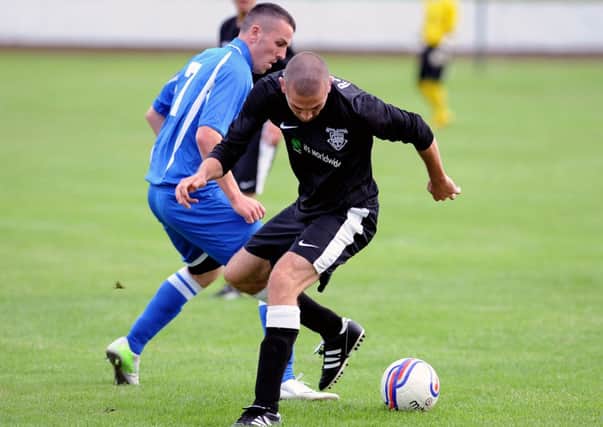 ATTACKING: Kilsyth Rangers' Dolan in the thick of the action.