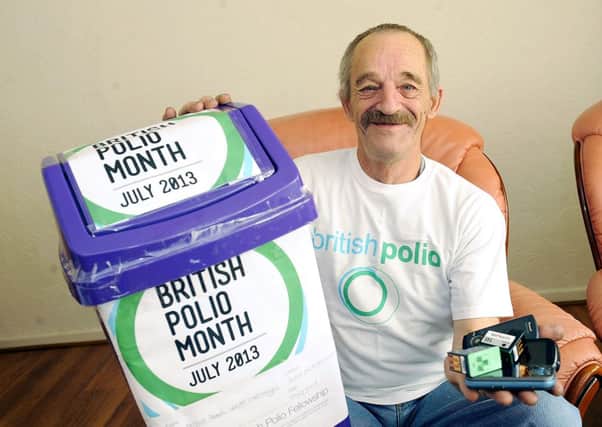 04-07-2013. Picture Michael Gillen. KILSYTH. Robert Cochrane who has polio and is collecting mobiles and ink cartridges for British Polio and polio awareness.