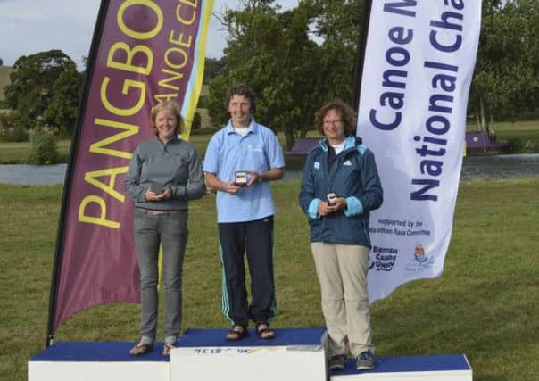 FIRST: Margaret Chapman on the podium at the British Canoe Marathon Championship on the River Thames at Pangbourne.