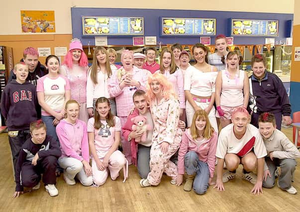 IN THE PINK: Youngsters of Our Ladys High School in Cumbernauld got dressed in pink to raise money for charity in 2003.