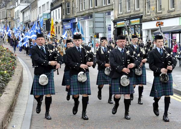 Piping them in...Lanark and District Pipe Band lead the Wallace Day March parade down Lanark High Street (Pic Lindsay Addison)