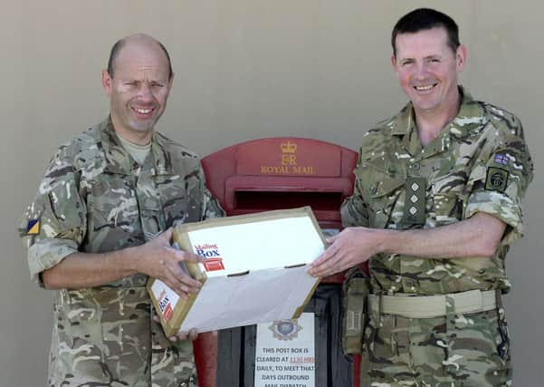Image of Sergeant George Cairns (45) and Captain Iain Macdonald (49).

An Army Reserves postman from Lanarkshire, who deployed to Afghanistan earlier this year, has

just discovered that he is delivering post in Camp Bastion to one of his Carluke neighbours.

Sergeant George Cairns (45) was born and raised in Carluke where he works as a postman. He 

lives just a few miles from Captain Iain Macdonald (49), another reservist and Senior Computing 

Technician at Glasgow University who moved to Carluke from Glasgow seven years ago.

Both men drink in the same pub as each other and even completed elements of their predeployment training together but until a few days ago they hadnt actually met.

That was, until Iain went to the Camp Bastion Post Office to send a parcel back to his wife in 

Carluke. George took one look at the postcode and, immediately recognising it, declared:

I deliver your mail in the UK!

George deployed to Afghanistan in March this year as a postal courier with the Royal Logistics

Corps