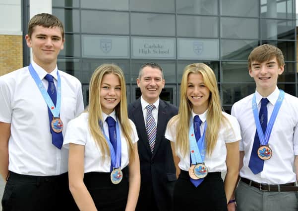 Carluke High School pupils who were medallists at International Children's Games in Canada
L-R
Conor Walker (15) S4 from Forth
Emily (14) S3 and Pamela (15) McNicol S4 and Ryan Scott (14) S4 from Carluke
Centre
New head teacher Andy Smith (45) from Lanark
Carluke
9/9/13