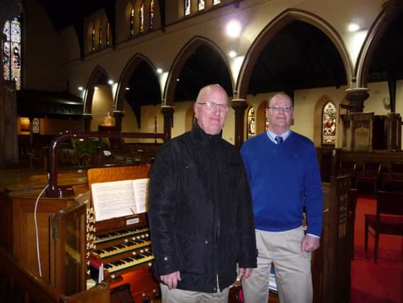 Organist Liam Devlin and minister David Black