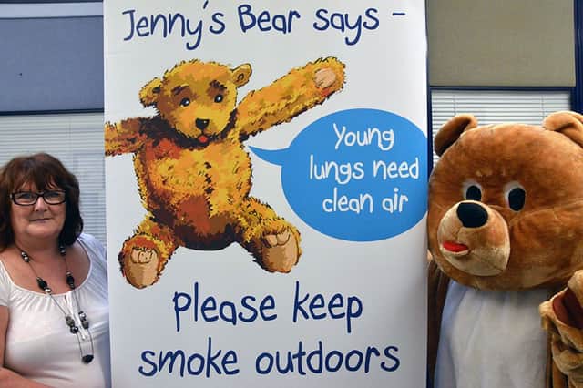 Lynn is pictured with the character from Jenny and the Bear.