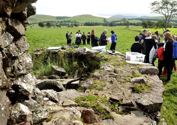 Heritage heroes...pupils from Biggar High take part in the archaeology project at the remains of Boghall Castle, Biggar (Pic Lindsay Addison)