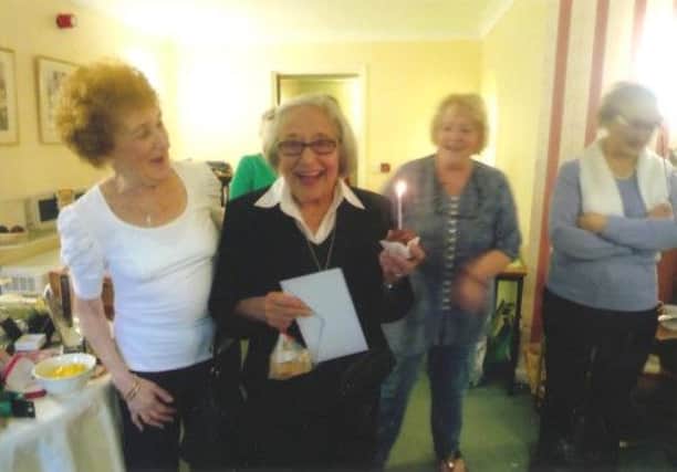 Above: Rosalind Green and Isa Schuster celebrate both the charity event and Isa's birthday. Below: Hawthorn Court residents take a coffee in aid of Macmillan - picture by Tommy Higgins.