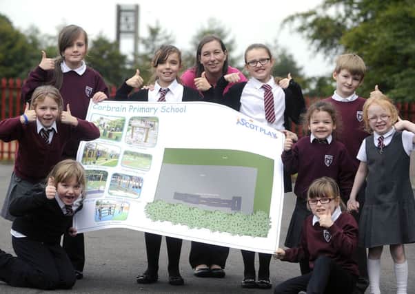 EXCITING TIMES: Pupils at Carbrain Primary School are delighted with the funding they received.