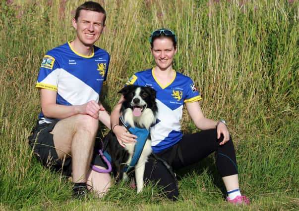 TEAM SCOTLAND: Amanda and John are pictured with border collie Bauer.