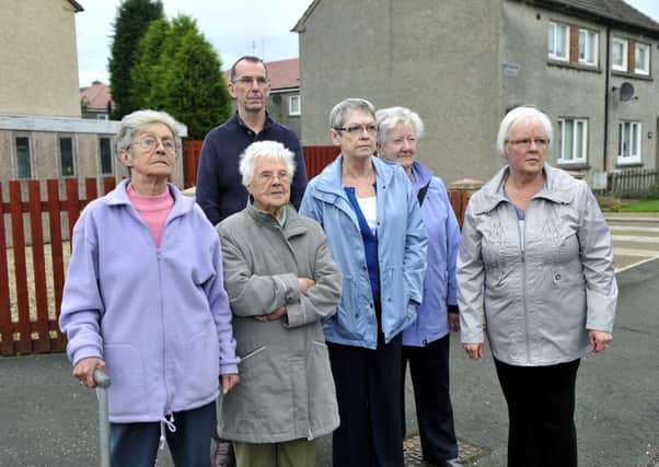 Frances Jardine (far right) and neighbouring residents who now have to walk half a mile to nearest bus stop after a bus route was changed Glenafeoch Road, Carluke