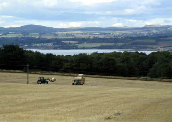 READER Jean Boustead took this picture of the hay gathering through the side window of a moving car as her husband drove them back from Queensferry. Quick snapping Jean! If you would like to share a picture, send it to Editor Julie Currie, 3 High Street, Carluke, ML8 4AL, or email jcurrie@jpress.co.uk