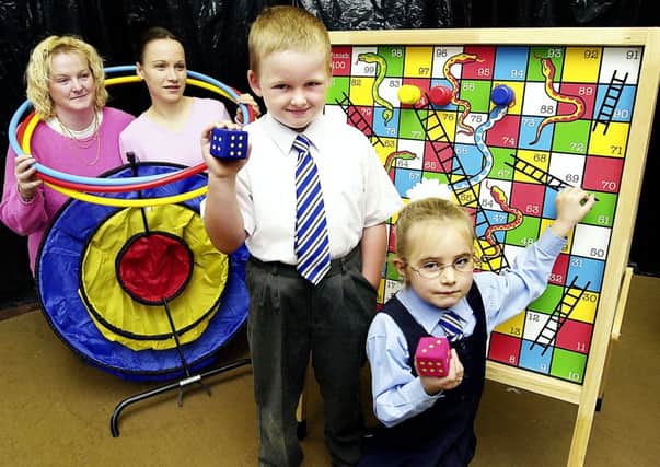 Fun times... Carluke PS pupils Jamie McFarlane (5) and Keeley Bruce (6) with the new play equipment