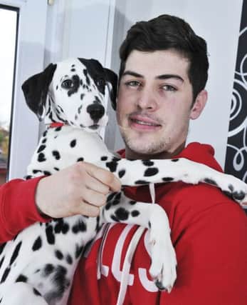 Aaron is pictured with pup Alfie.