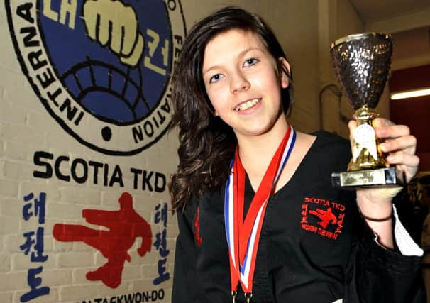 Battling back...Catherine McIntyre is now a gold medal winner at taekwon-do (Pic Lindsay Addison)