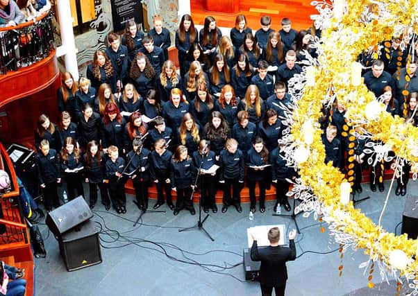 Packing them in...Shine perform for Glasgow shoppers (Pic Scott Gibson)