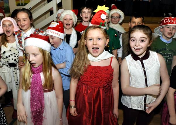 Hitting the right notes...at Law Primary School with The Twelve Hits of Christmas (Pic by Lindsay Addison)