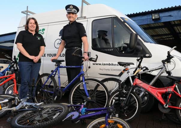ON THEIR BIKES: Angela Fitzsimons of I AM Bikes with Chief Inspector David Bruce.