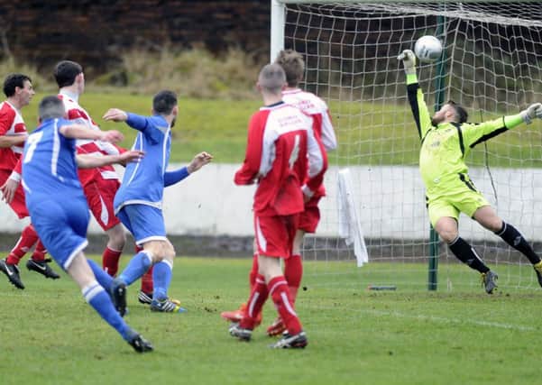 OPENER: Phillip Dolan (number seven) fires Rangers' first goal into the net, during their Scottish Junior Cup fourth-round tie against Largs Thistle.