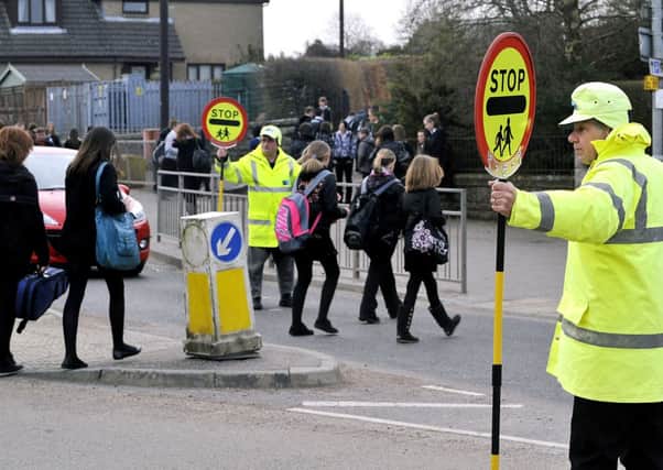 For the chop...some lollipop men and women will be axed in the 170-strong jobs cull at South Lanarkshire Council (Pic Lindsay Addison)