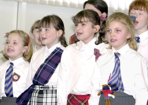IN CONCERT: Youngsters of Chapelgreen Primary take part in a Scots Concert in February 2004.