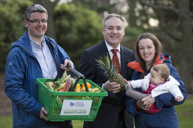 Environment Secretary, Richard Lochhead with Food Waste case study family Alastair Davidson, Laura Davidson and their daughter Isobel.