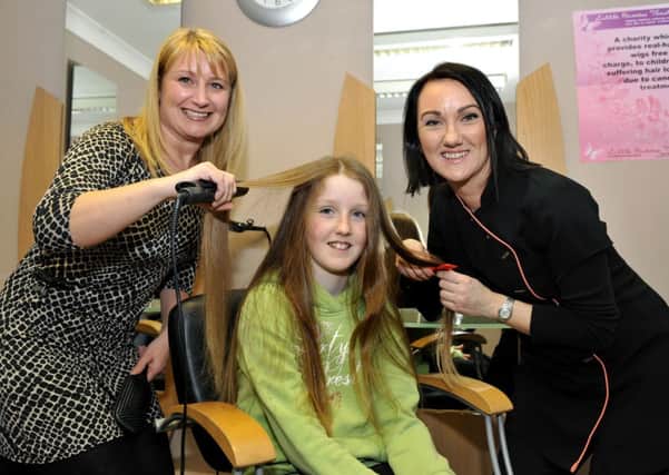 Snip...Caragh, with Jan Rooney and her mum Vicki (pic Lindsay Addison)