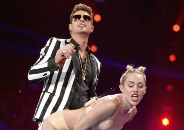 In the Thicke of it...Miley Cyrus and Robin Thicke caused a sensation at MTV Awards but channel has not been banned by South Lanarkshire Council (Photo by Jeff Kravitz)