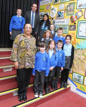 Millersneuk Primary head teacher Greg Caldow is pictured with Fatima Ismael and the pupil council.