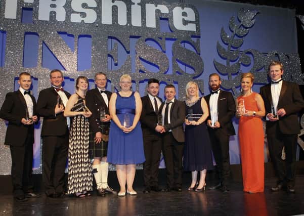 Onto a winner...the 2014 Lanarkshire Business Awards winners take centre stage at the ceremony