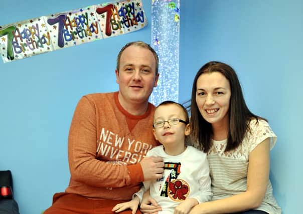 Many happy returns...Colin and Louise Ireland are delighted with Ben's new sensory room, unveiled to coincide with his seventh birthday (Pic Lindsay Addison)