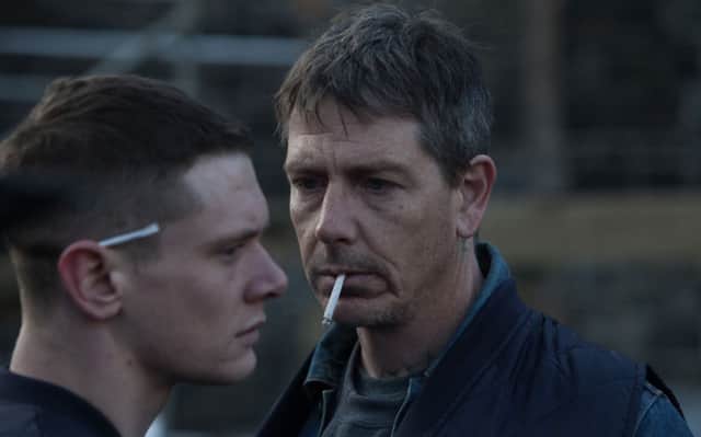 Jack O Connell playing Eric and Ben Mendelsohn playing Neville.